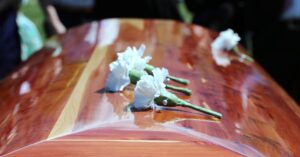Casket with white carnations