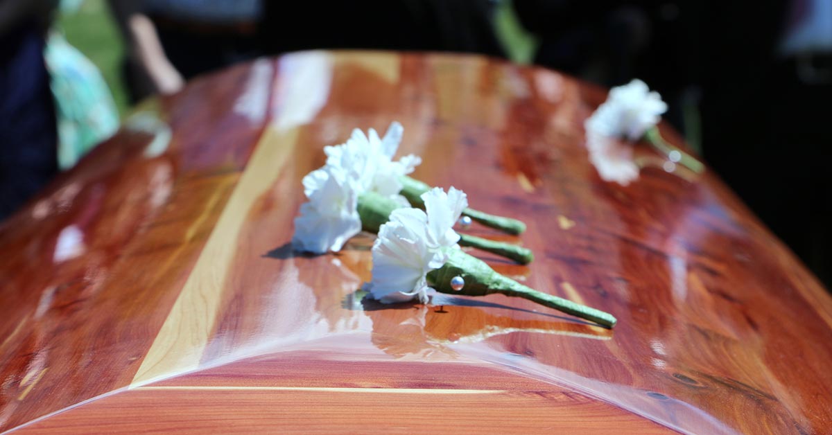 Casket with white carnations